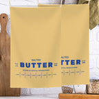 Personalized butter tea towel hanging in kitchen with bold butter label design. Absorbent microfiber towel for everyday use, decor, and custom gift ideas.