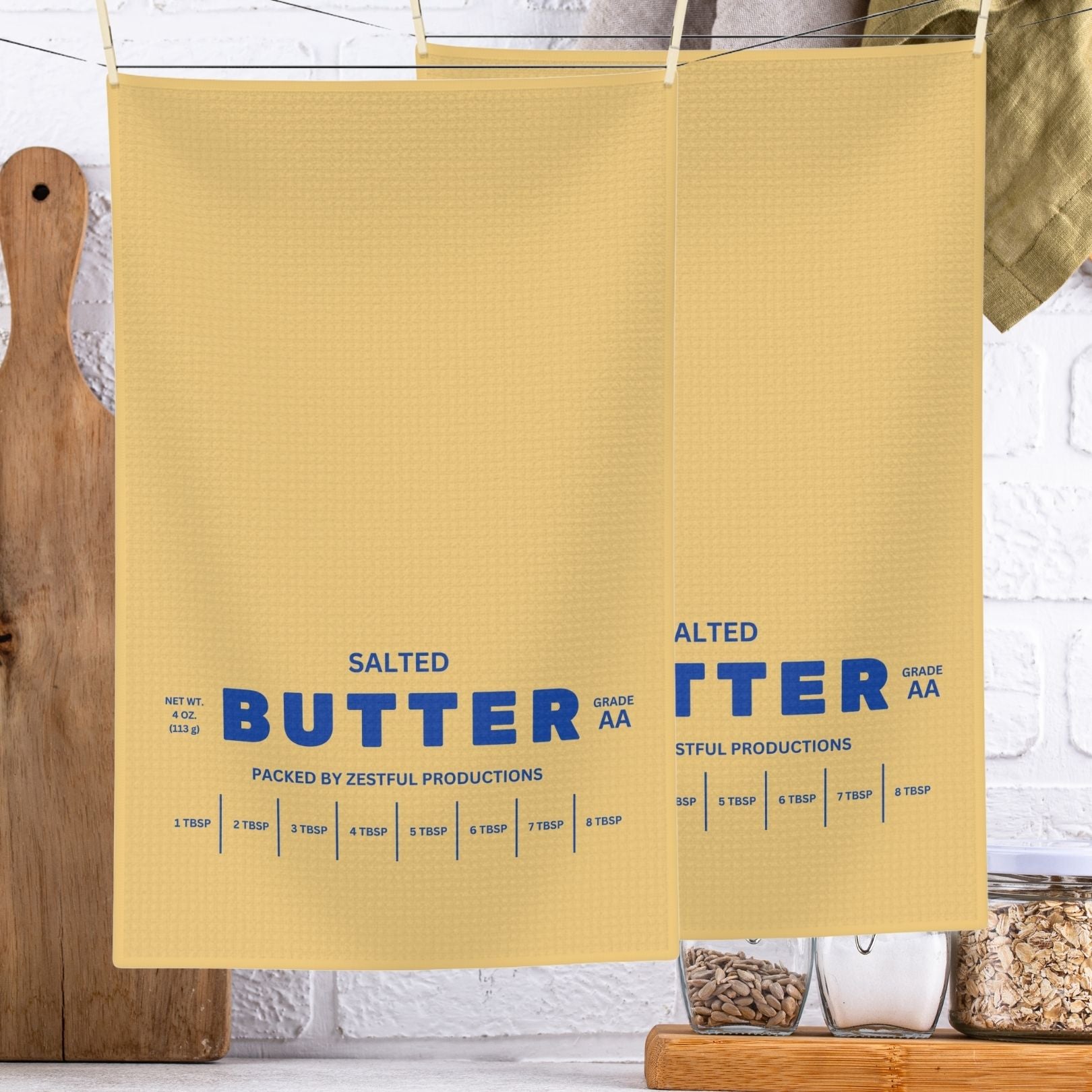 Personalized butter tea towel hanging in kitchen with bold butter label design. Absorbent microfiber towel for everyday use, decor, and custom gift ideas.
