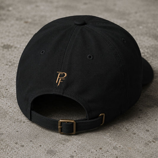 Back view of black embroidered Poopenfarten Motorwerke cotton dad cap featuring adjustable brass buckle strap and rear PF logo embroidery.