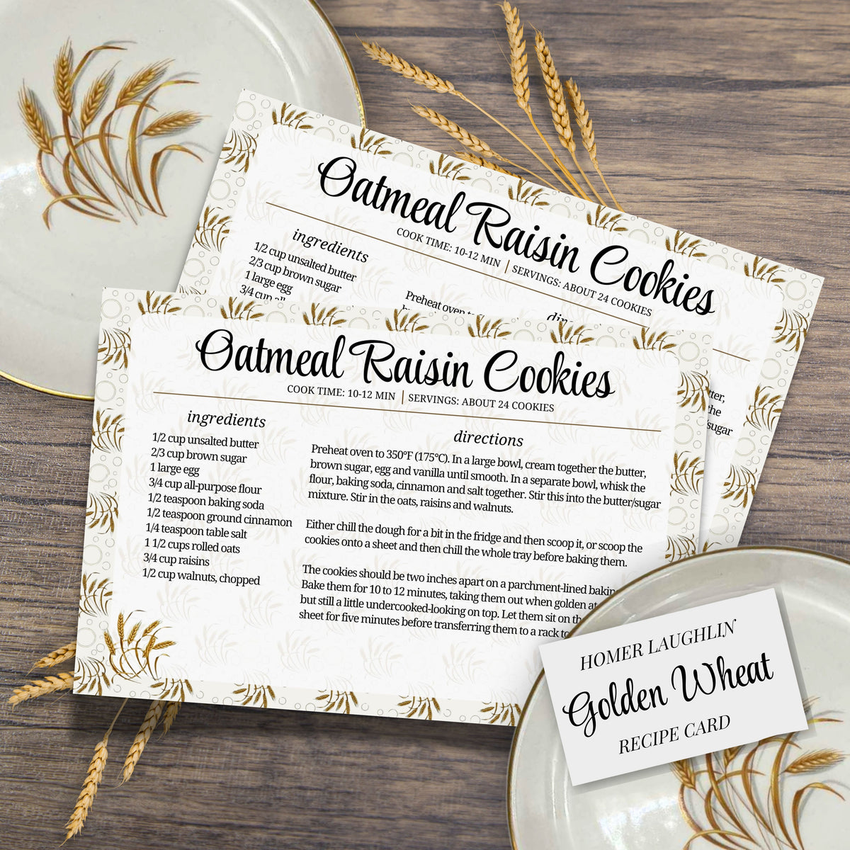 Printed oatmeal raisin cookie recipe cards arranged with vintage Golden Wheat dishes and wheat stalks on a dark wooden table. The coordinated 4 x 6 inch cards bring nostalgic charm to a collected kitchen or family recipe box.