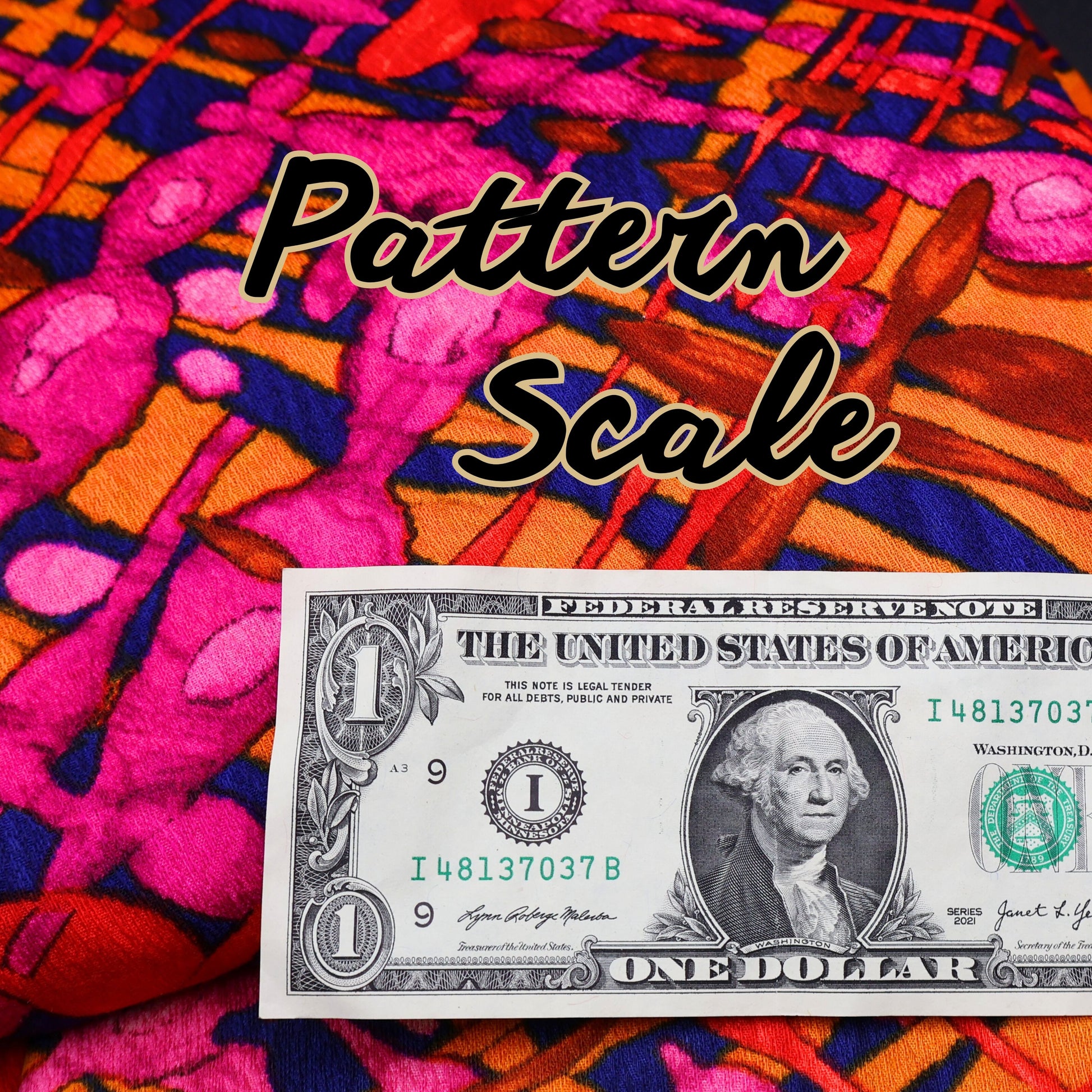 Close-up of vintage curtain fabric showing pattern scale next to dollar bill for size reference.