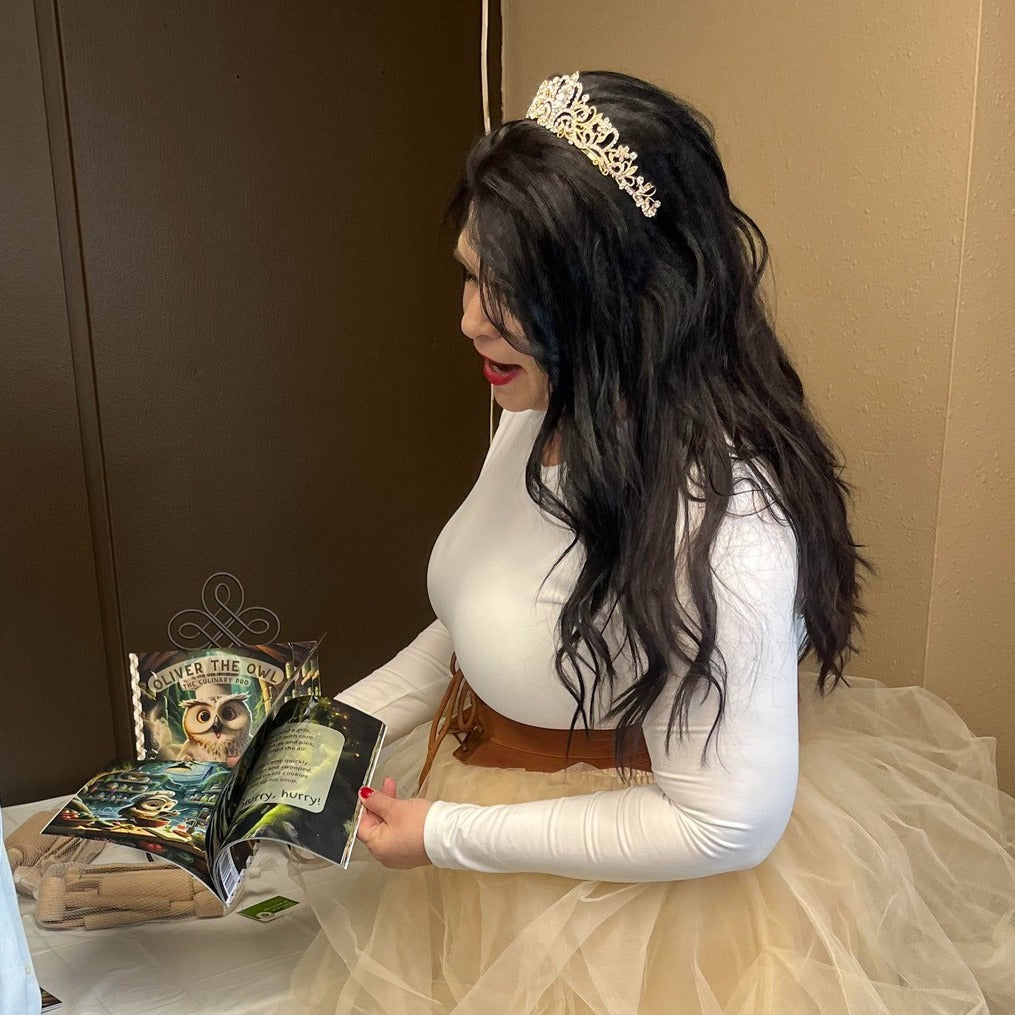 Children’s book author Rayna Jo Zest holds her debut book, Oliver the Owl: The Culinary Pro, during a book signing and meet-the-author event.