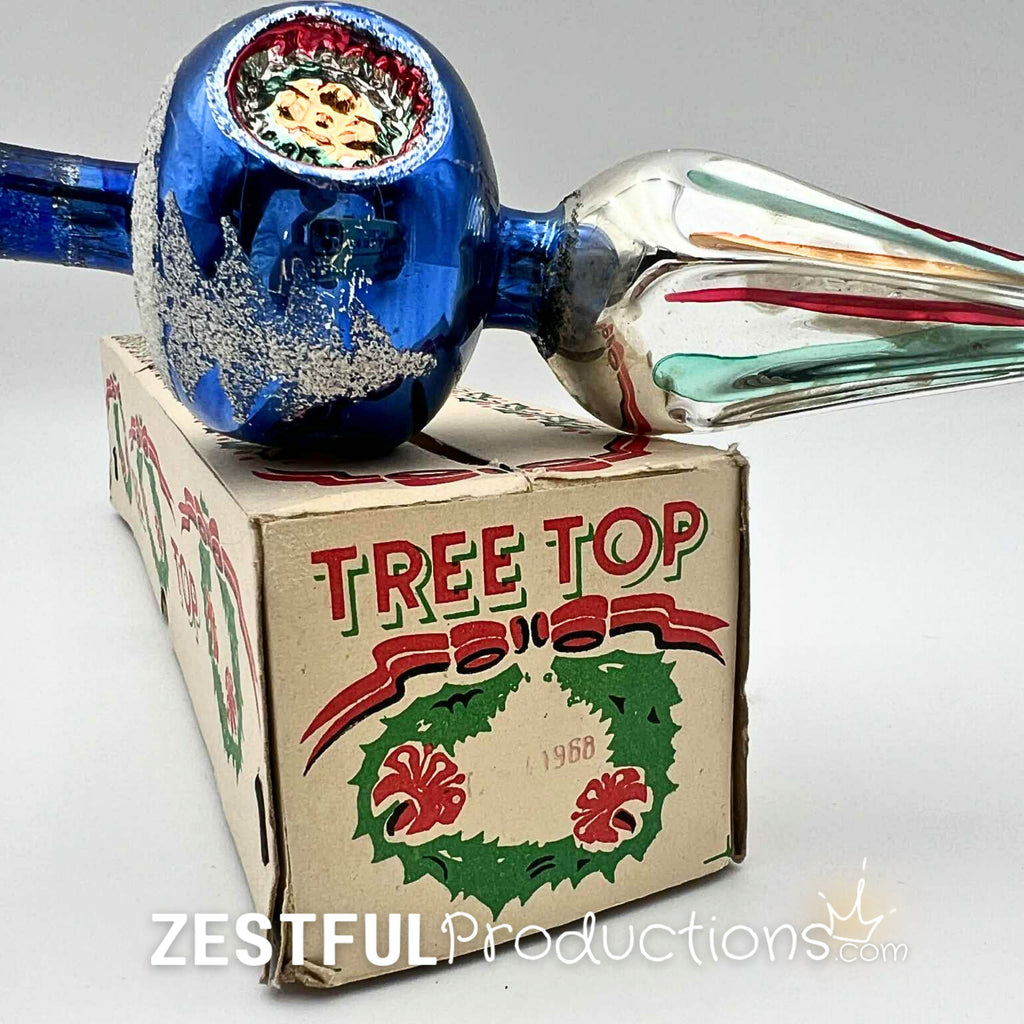 Close-up of vintage blue mercury glass Christmas tree topper with indented reflector detail and original box, showcasing mid century handblown holiday ornament craftsmanship from the 1960s.