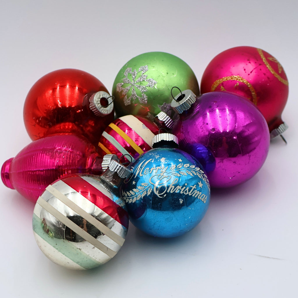 Curated retro Christmas ornament bundle with jewel tone mercury glass baubles in pink blue green and silver on white background