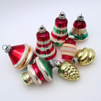 Vintage mercury glass Christmas ornaments with striped lantern shapes and reflective retro holiday finishes