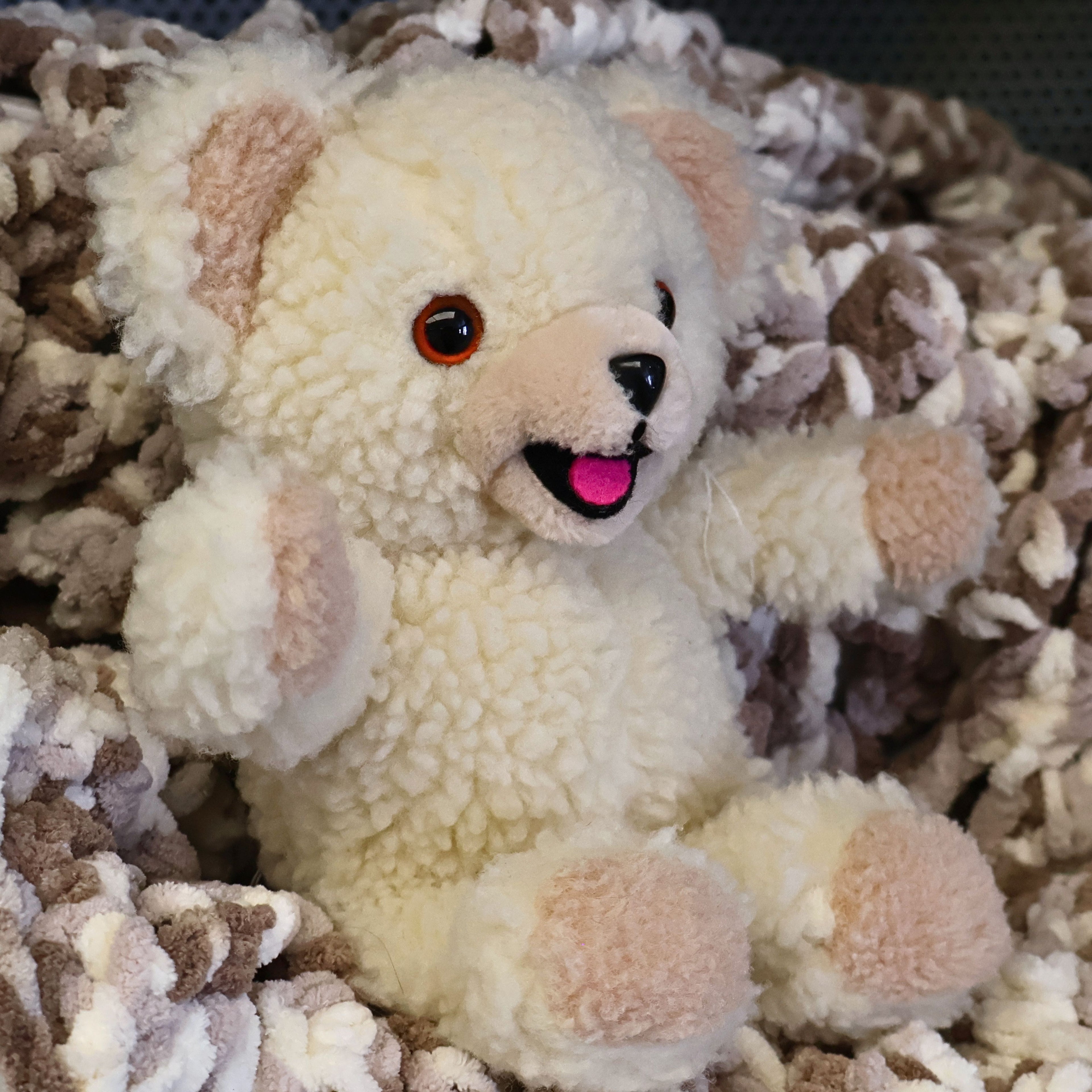Close-up of a vintage 1986 Snuggle laundry mascot plush featuring bright amber eyes, soft sherpa texture, and cheerful expression. A classic Lever Brothers advertising collectible perfect for retro toy collectors and nostalgic home decor.