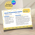 Salted butter-themed recipe card displaying a completed classic peanut butter cookie recipe. The playful 4 x 6 inch design features cobalt blue lettering, sunny yellow details, a wavy border and a butter tablespoon guide for home bakers.