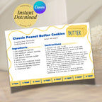 Salted butter-themed recipe card displaying a completed classic peanut butter cookie recipe. The playful 4 x 6 inch design features cobalt blue lettering, sunny yellow details, a wavy border and a butter tablespoon guide for home bakers.