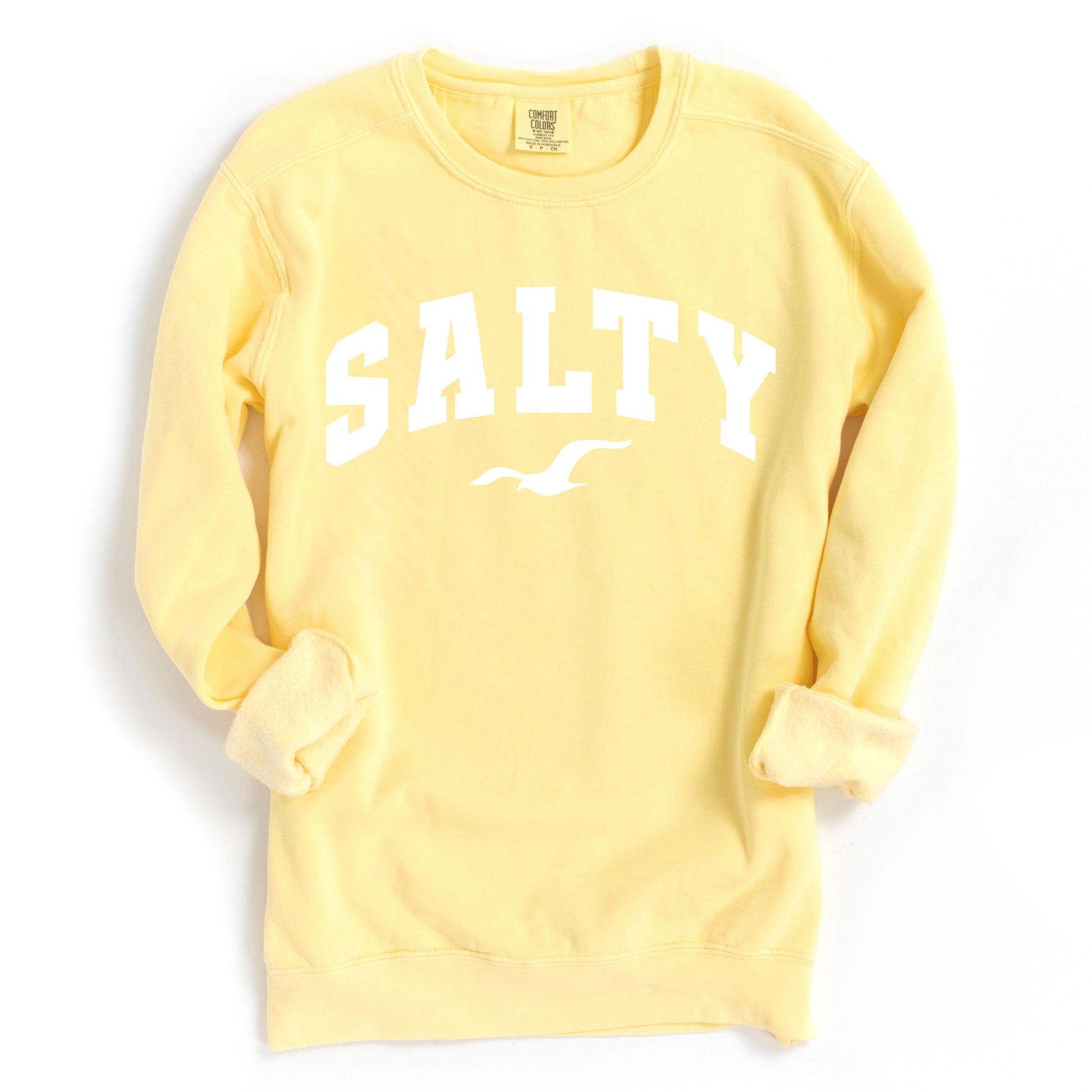 Butter yellow SALTY sweatshirt flat lay, oversized crewneck sweatshirt color option, coastal graphic sweatshirt, soft cotton blend beachwear, casual vacation clothing for women, nautical style top, relaxed fit sweatshirt