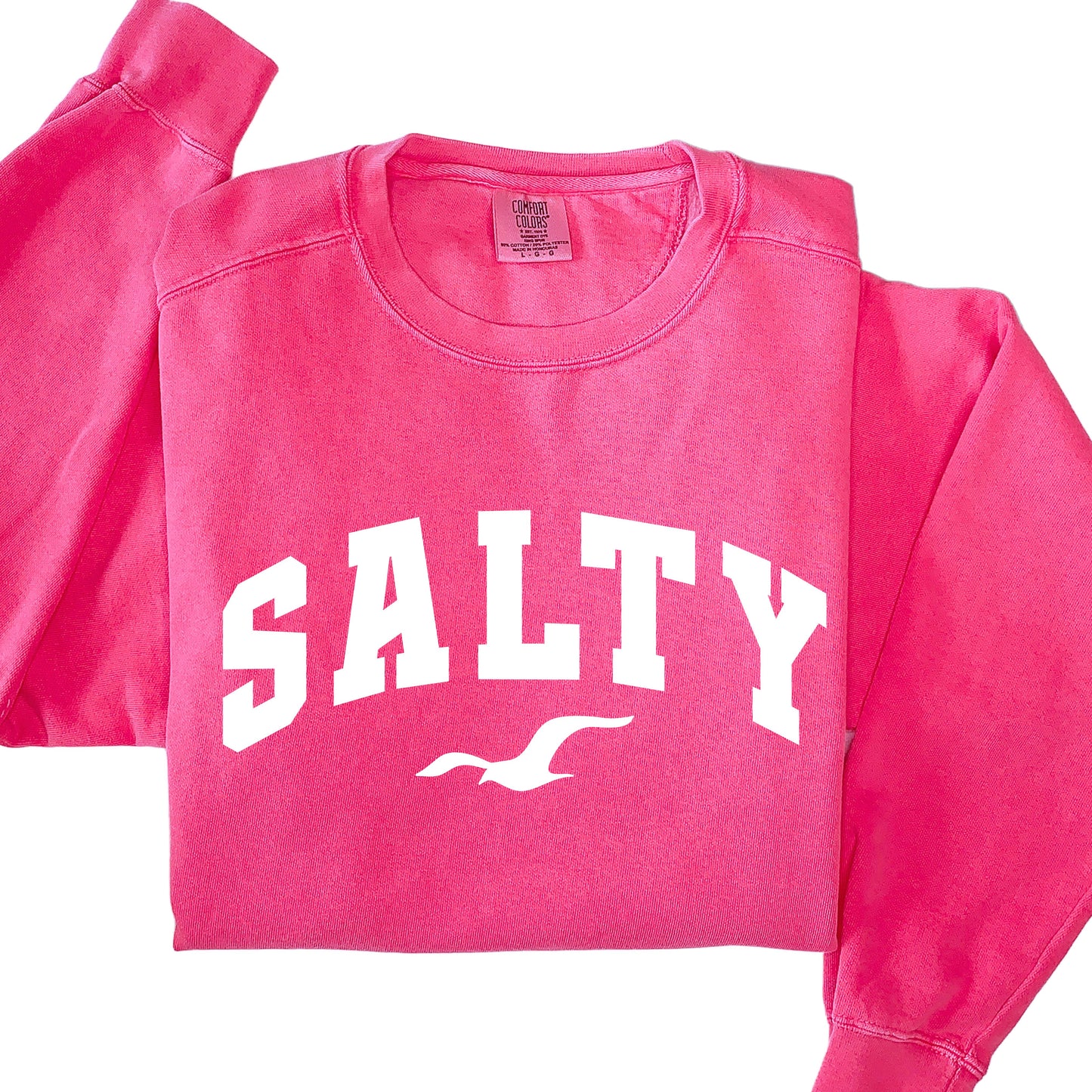 Watermelon pink SALTY sweatshirt flat lay, oversized beach crewneck sweatshirt, bold coastal color option, casual vacation clothing for women, soft cotton blend sweatshirt, nautical graphic top