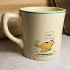 Reverse side of vintage Ovaltine mug featuring Sandy the dog running with the caption "Sandy's running for his Ovaltine."