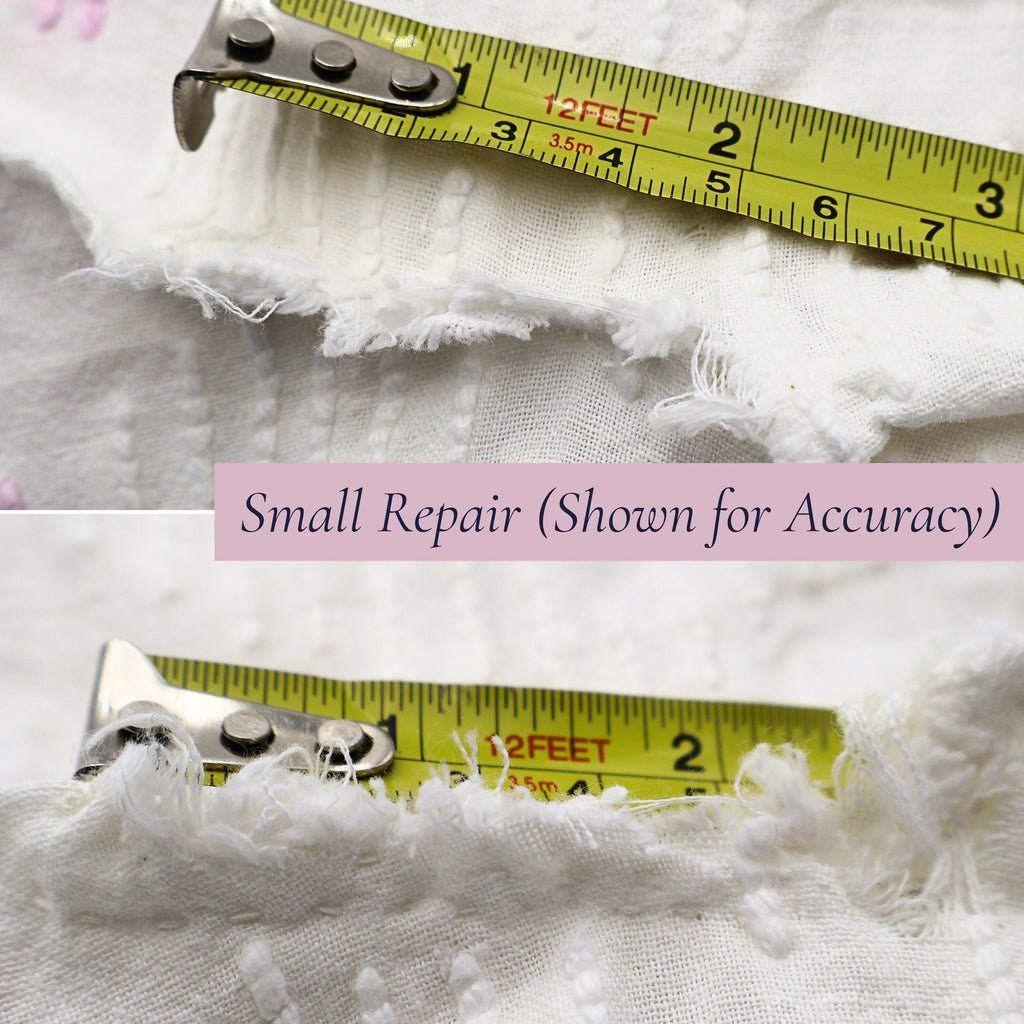 Close-up showing the small repaired area on the vintage white chenille bedspread with measuring tape for scale. The repair has been clearly photographed for transparency while preserving the beauty, usability, and heirloom appeal of this vintage textile.