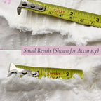 Close-up showing the small repaired area on the vintage white chenille bedspread with measuring tape for scale. The repair has been clearly photographed for transparency while preserving the beauty, usability, and heirloom appeal of this vintage textile.