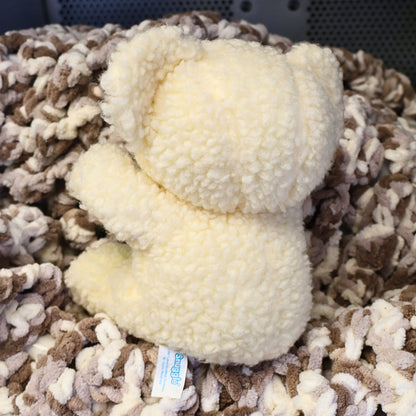 Rear view of an original Snuggle Bear plush displaying thick sherpa-style fabric, full body shape, and attached manufacturer tag. This authentic Lever Brothers advertising collectible is perfect for vintage plush collections, nostalgic displays, and cozy home decor.