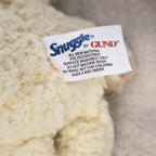 Close-up of the original Snuggle by GUND fabric tag attached to the vintage plush mascot. The label confirms licensed GUND production and helps authenticate this nostalgic advertising collectible for vintage plush collectors.