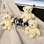 Three vintage Snuggle by GUND plush mascots arranged around a vintage Procter & Gamble laundry soap package. The cozy display highlights their charming expressions and fluffy cream fur, ideal for collectors of advertising memorabilia, GUND plush, and nostalgic home decor.