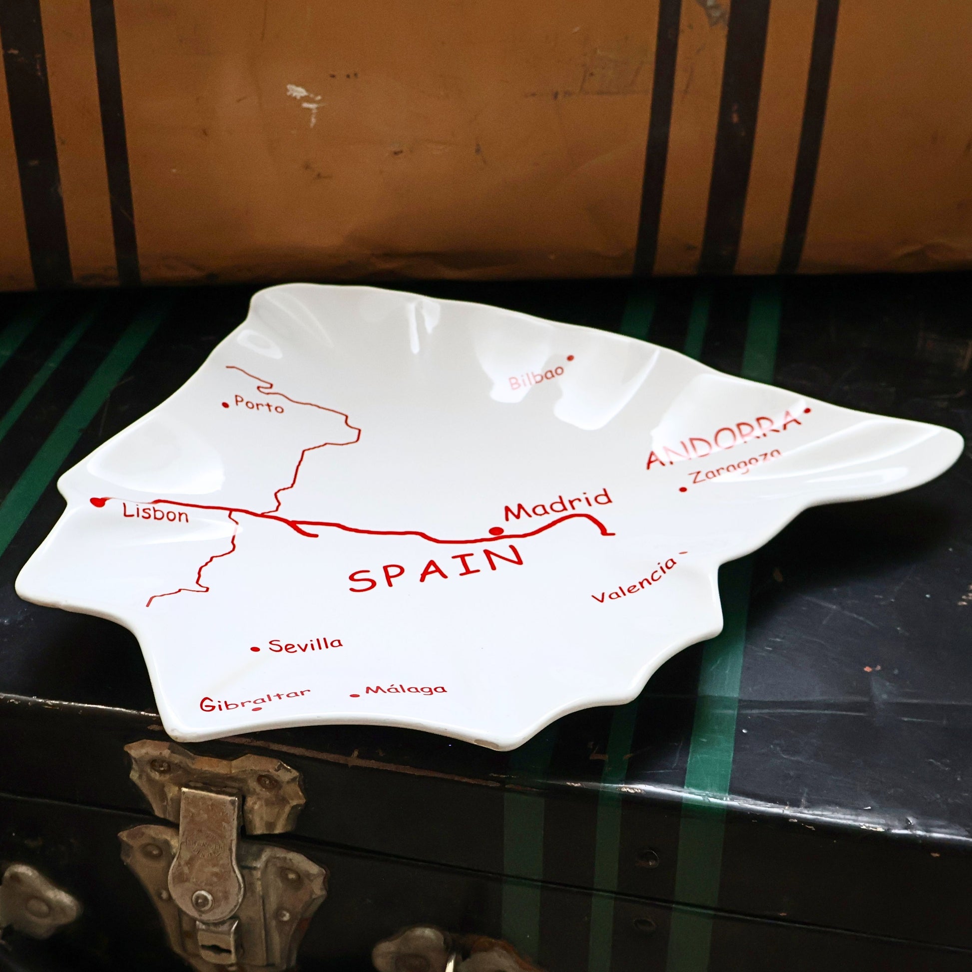 Side angle view of vintage Spain map ceramic serving tray showing sculptural edges and glossy finish, Spain shaped Mediterranean tapas platter, European travel decor dish, collectible ceramic serving piece for home styling