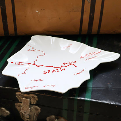 Side angle view of vintage Spain map ceramic serving tray showing sculptural edges and glossy finish, Spain shaped Mediterranean tapas platter, European travel decor dish, collectible ceramic serving piece for home styling