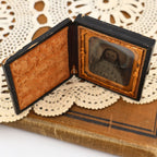 Interior view of the antique thermoplastic Union case highlighting the richly embossed velvet panel, ornate gilt brass mat, and preserved Civil War era ambrotype portrait. Fine decorative details illustrate why these nineteenth-century photography cases remain collectible today.