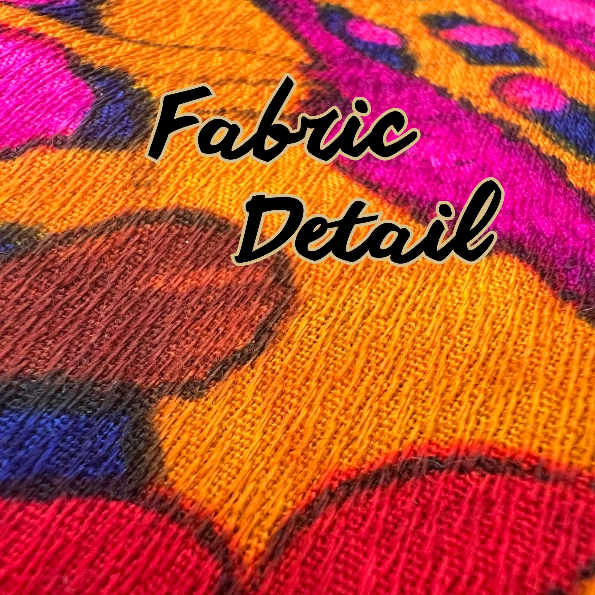 Detailed view of vintage curtain fabric texture in bold pink, orange, and yellow tones.