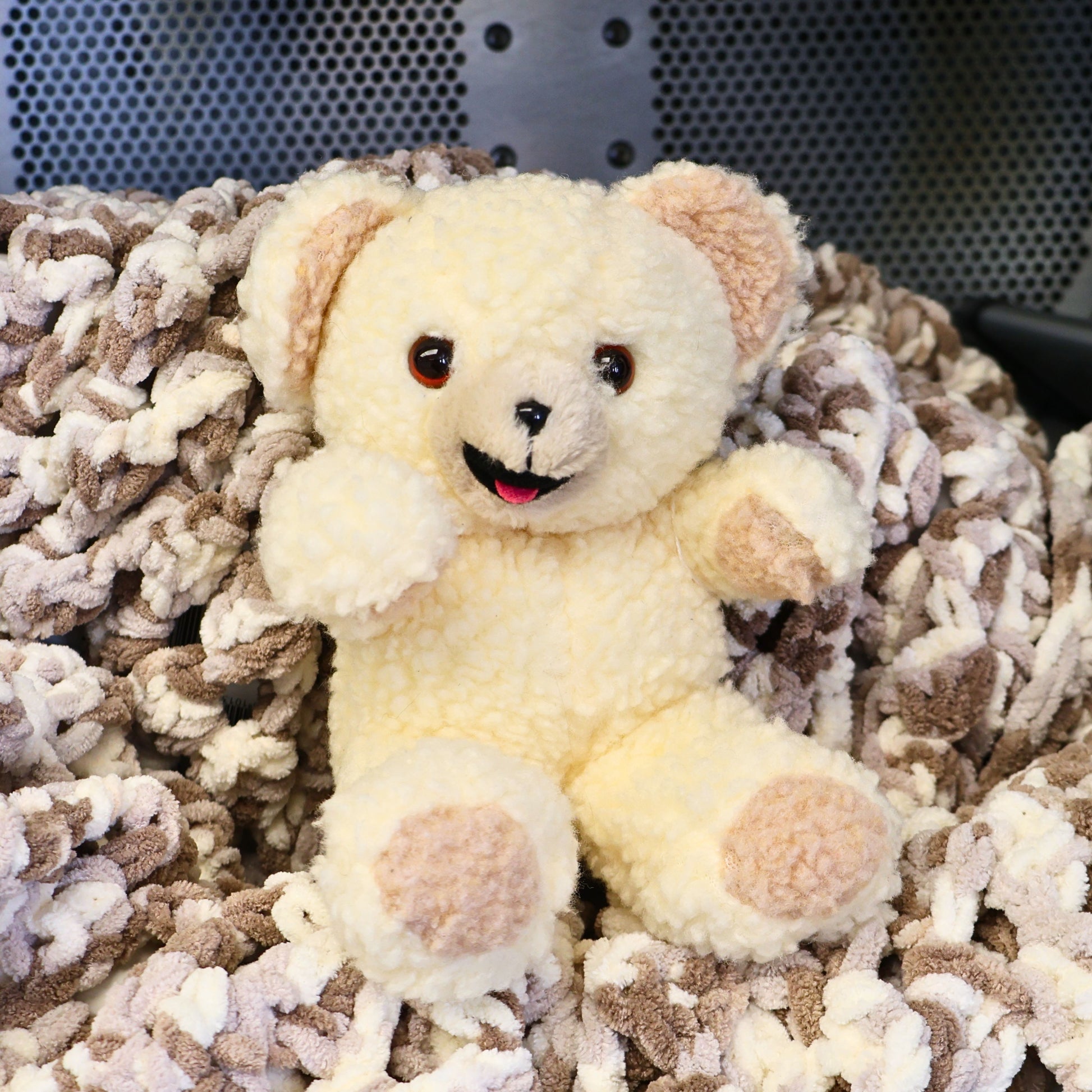 Vintage 1997 Snuggle Bear plush by Lever Brothers Company sitting upright with a smiling face and soft ivory sherpa fur. This original 10-inch fabric softener mascot makes a charming vintage advertising collectible, laundry room accent, nostalgic gift, or retro plush display.