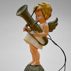 Single vintage angel bell ornament featuring cherub playing a horn instrument standing on a gold glitter bell. Side profile shows wing detail and hanging string. Mid century West Germany Christmas ornament collectible