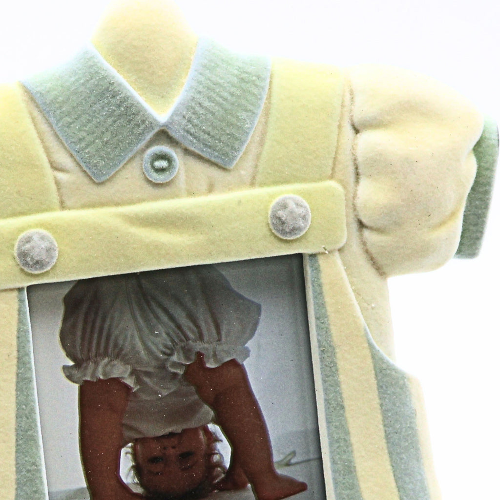 Closeup detail of vintage baby boy picture frame featuring pastel blue collar dimensional buttons flocked resin texture and heirloom inspired nursery decor styling