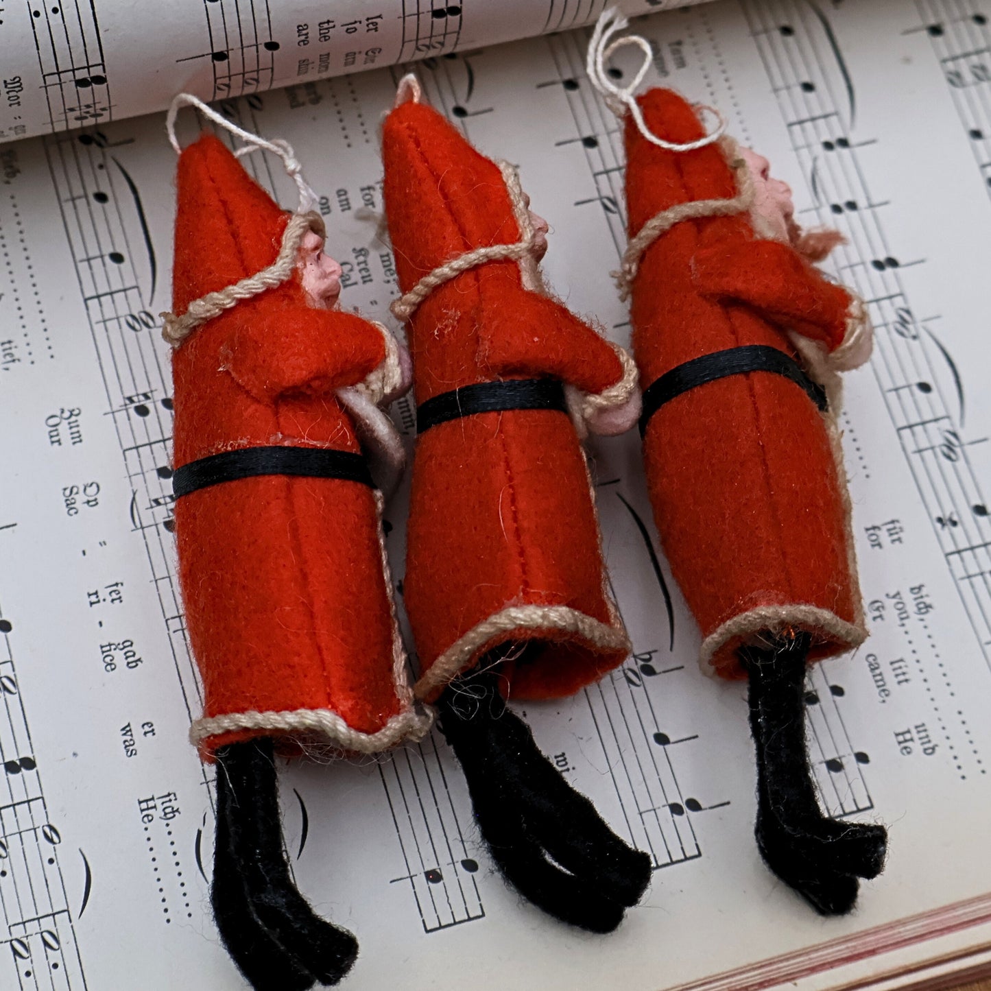 Vintage Belsnickle Santa ornaments rear detail highlighting handmade structure and aged materials