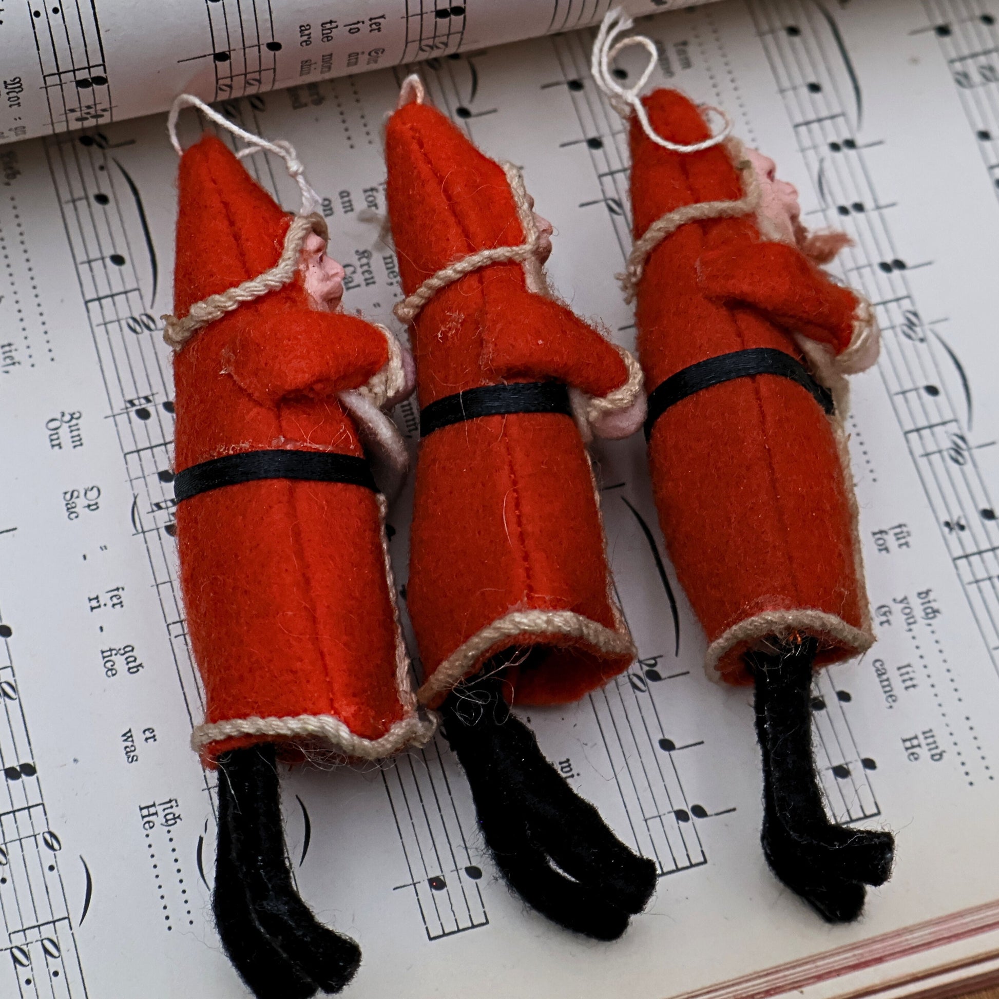 Vintage Belsnickle Santa ornaments rear detail highlighting handmade structure and aged materials