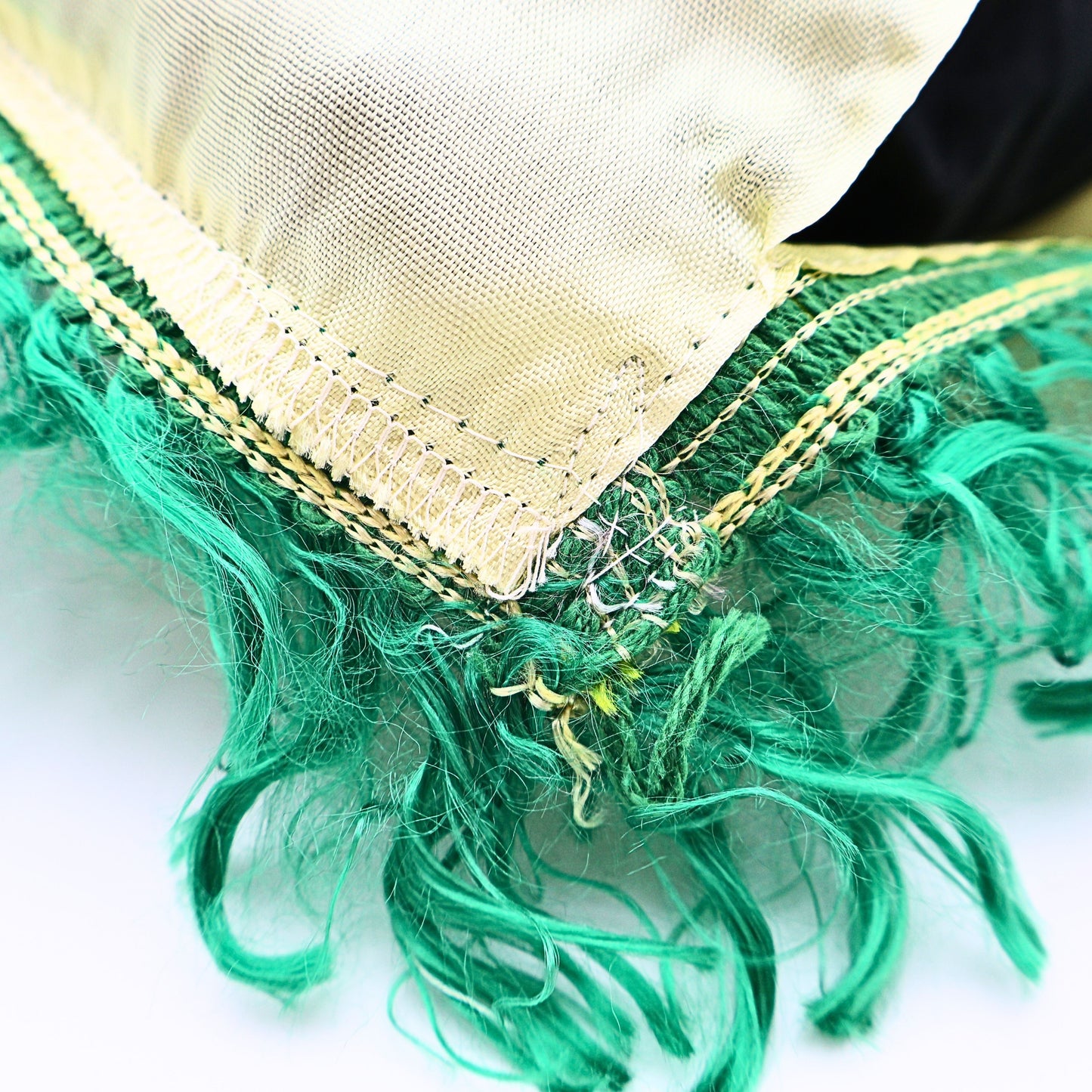 Green fringe and stitching detail on vintage South Dakota pillowcase cover