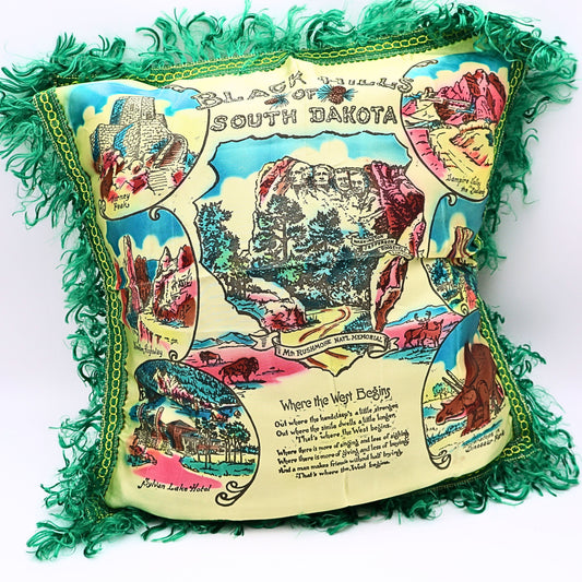 Vintage Black Hills South Dakota souvenir pillowcase cover with illustrated landmarks and green fringe