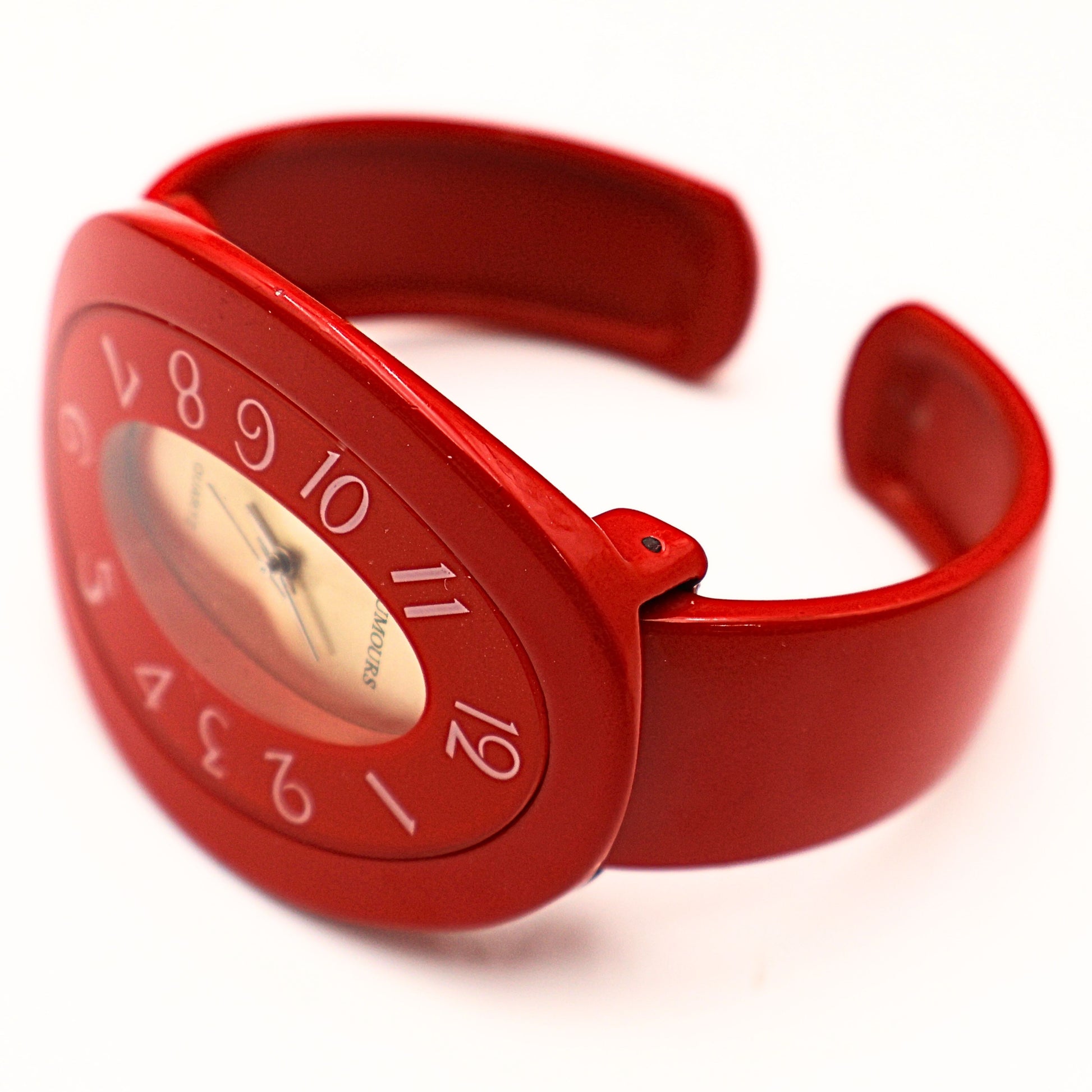 Vintage Rumours 29978 red bracelet watch shown open cuff style, flexible bangle fit with bold statement design and retro 90s fashion aesthetic