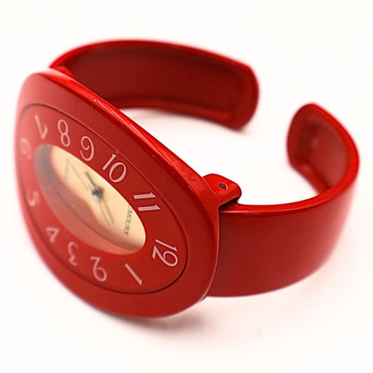 Vintage Rumours 29978 red bracelet watch shown open cuff style, flexible bangle fit with bold statement design and retro 90s fashion aesthetic