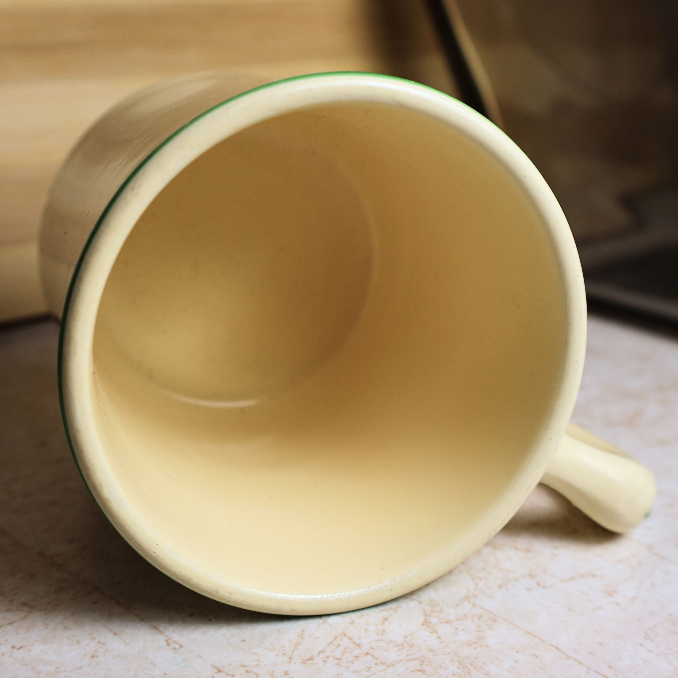 Interior view of the vintage Ovaltine ceramic mug showing the clean cream-colored glazed interior.