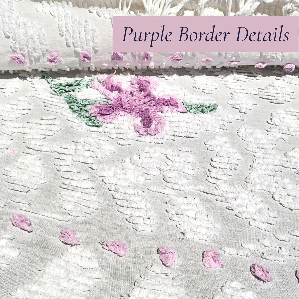Close-up of the decorative lavender border on a vintage white chenille bedspread featuring raised chenille texture and delicate stitched accents. This heirloom textile complements cottage bedroom decor, farmhouse interiors, shabby chic decorating, and vintage home collections.