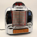 Vintage Crosley CR-9 jukebox radio with illuminated display and chrome finish, retro 1950s diner decor music player featuring rotating song list and nostalgic lighting
