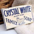 Authentic vintage Crystal White Family Soap in its original Colgate-Palmolive-Peet paper wrapper featuring the classic Peet's sheep logo. This mid-century laundry soap bar is a wonderful advertising collectible for farmhouse decor, vintage laundry room displays, Americana collections, and nostalgic home styling.