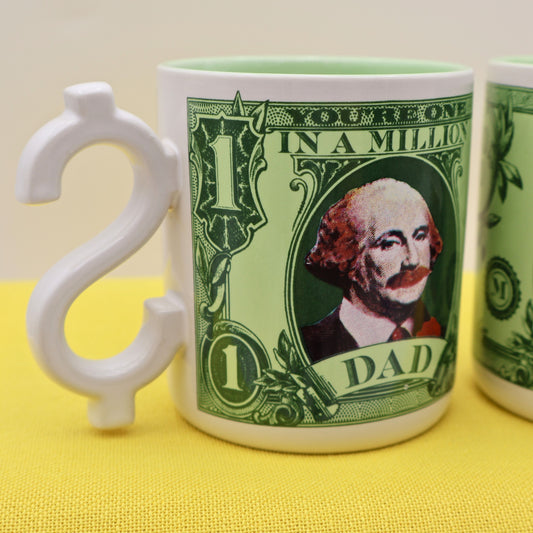 Close up of vintage Dad coffee mug with green money design and sculpted dollar sign handle