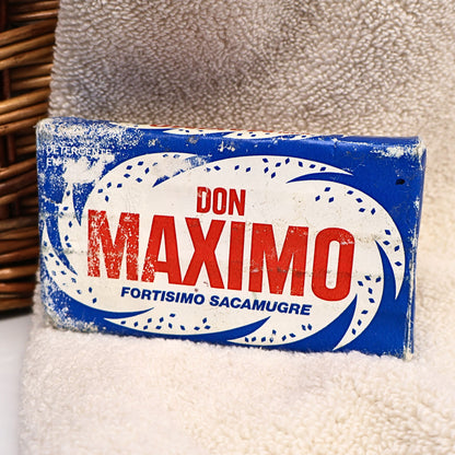 Authentic vintage Don Maximo Laundry Soap by Procter & Gamble de Mexico in its original blue and red Spanish-language wrapper. This colorful advertising collectible is ideal for vintage laundry room decor, international advertising collections, farmhouse displays, photography styling, and nostalgic home decor.