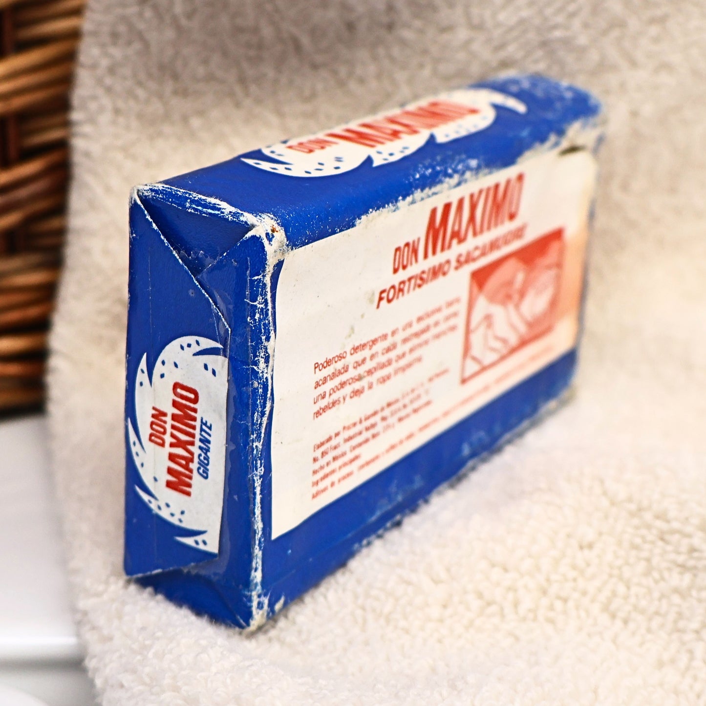 Opposite side of a vintage Don Maximo Laundry Soap bar featuring colorful Spanish branding and original paper packaging from Procter & Gamble de Mexico. This nostalgic advertising collectible adds character to farmhouse decor, vintage laundry displays, Americana collections, and photography props.
