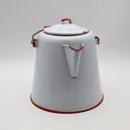 Side view of vintage enamel coffee pot showing red trimmed spout and classic ranch styling