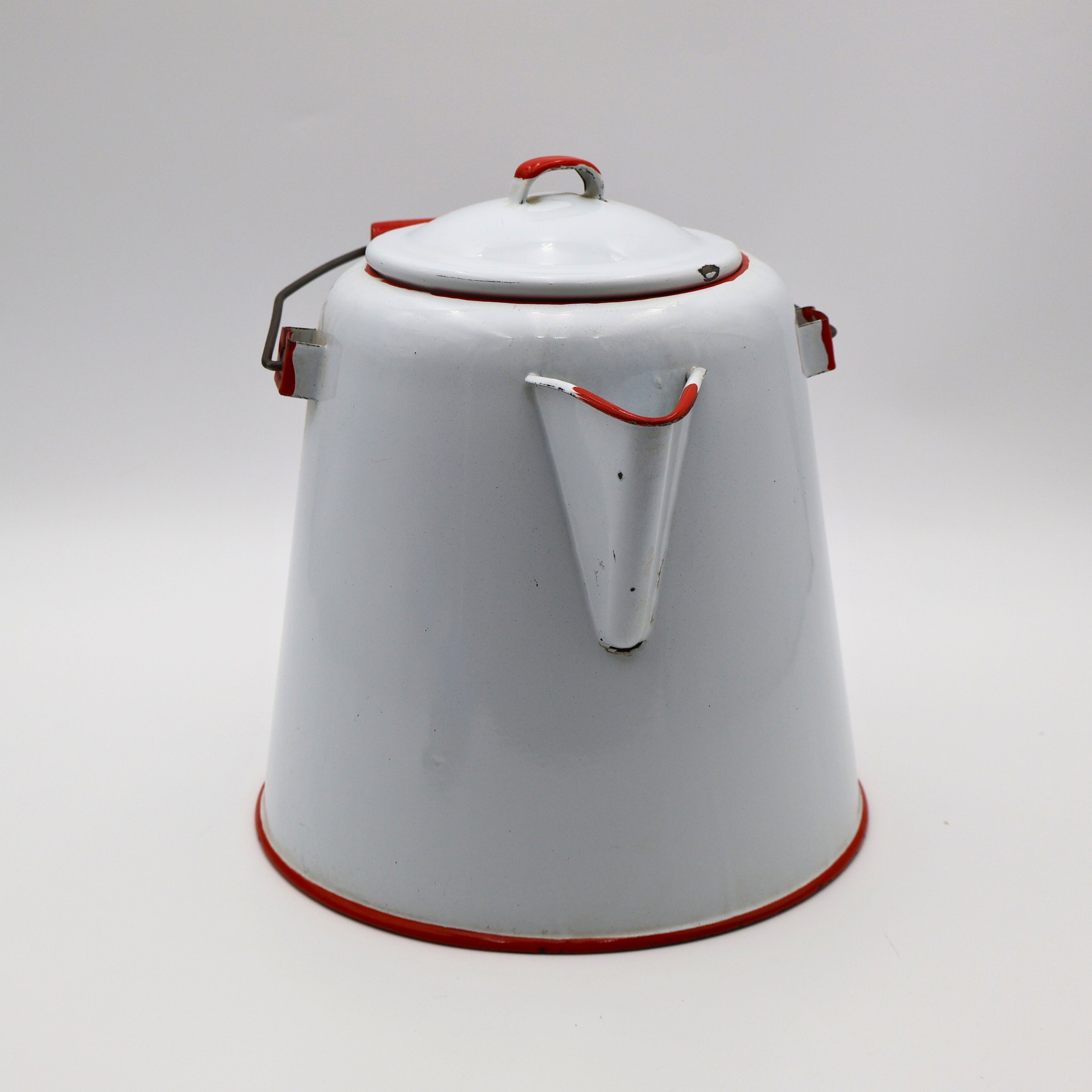 Side view of vintage enamel coffee pot showing red trimmed spout and classic ranch styling