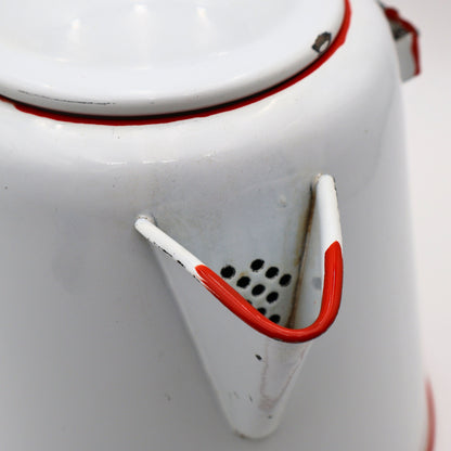 Detail view of vintage enamel coffee pot showing red trimmed spout and classic ranch styling
