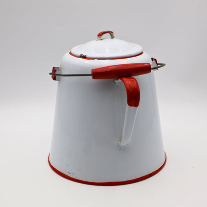 Rear view of large white enamel cowboy coffee pot with red handle and metal bail