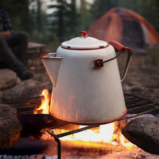A mockup image of a vintage enamelware coffee pot over a campfire in a camp setting