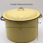 Vintage yellow enamelware stock pot with matching lid shown with approximate measurements of 11 inches in diameter and 7.5 inches tall. A large vintage farmhouse kitchen piece ideal for decorating, storage, and collecting.