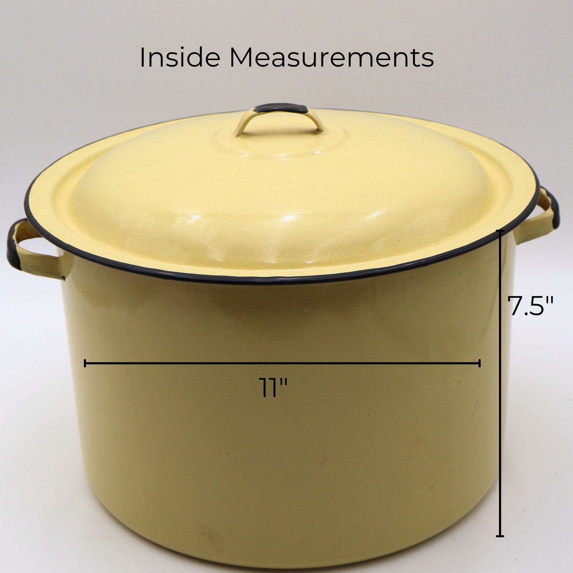 Vintage yellow enamelware stock pot with matching lid shown with approximate measurements of 11 inches in diameter and 7.5 inches tall. A large vintage farmhouse kitchen piece ideal for decorating, storage, and collecting.