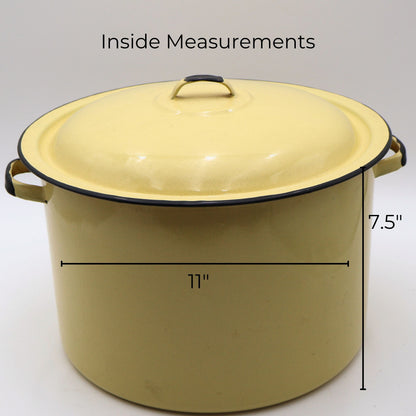 Vintage yellow enamelware stock pot with matching lid shown with approximate measurements of 11 inches in diameter and 7.5 inches tall. A large vintage farmhouse kitchen piece ideal for decorating, storage, and collecting.