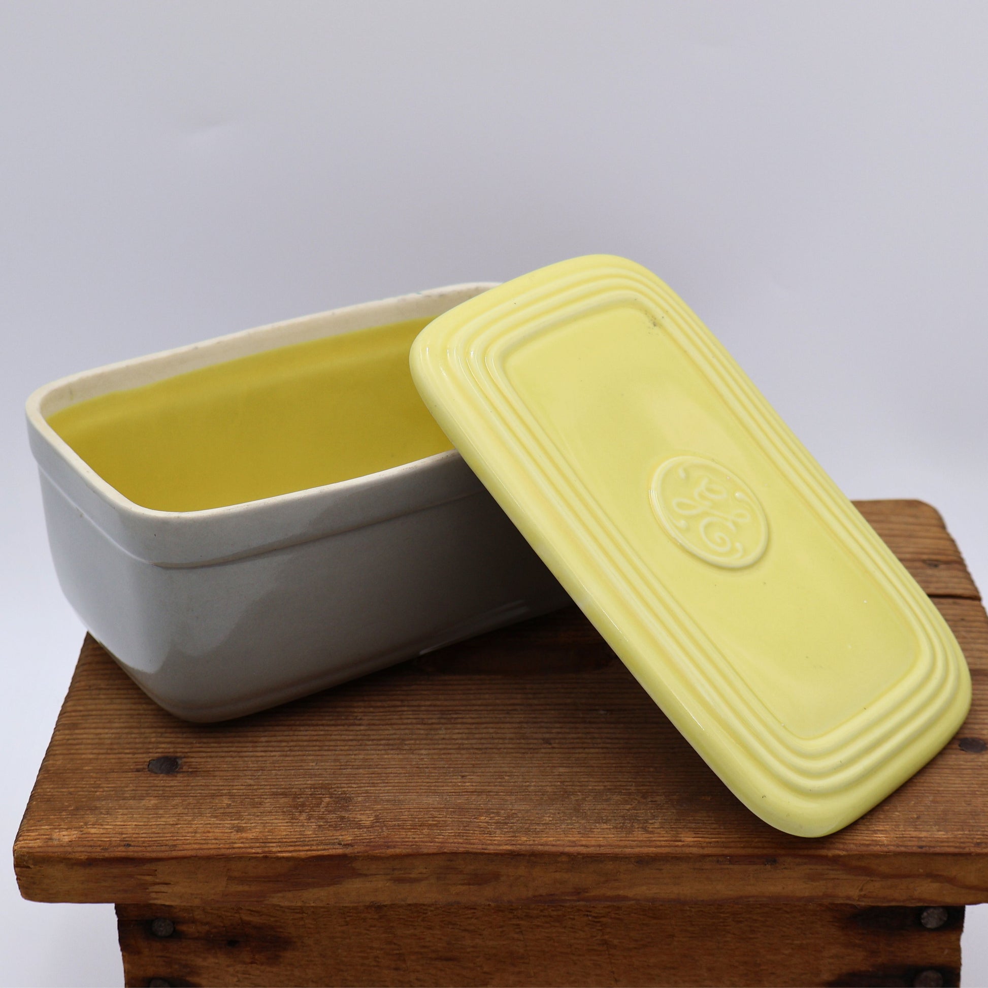 Interior of vintage GE refrigerator dish showing glazed ceramic storage container by Hall China.