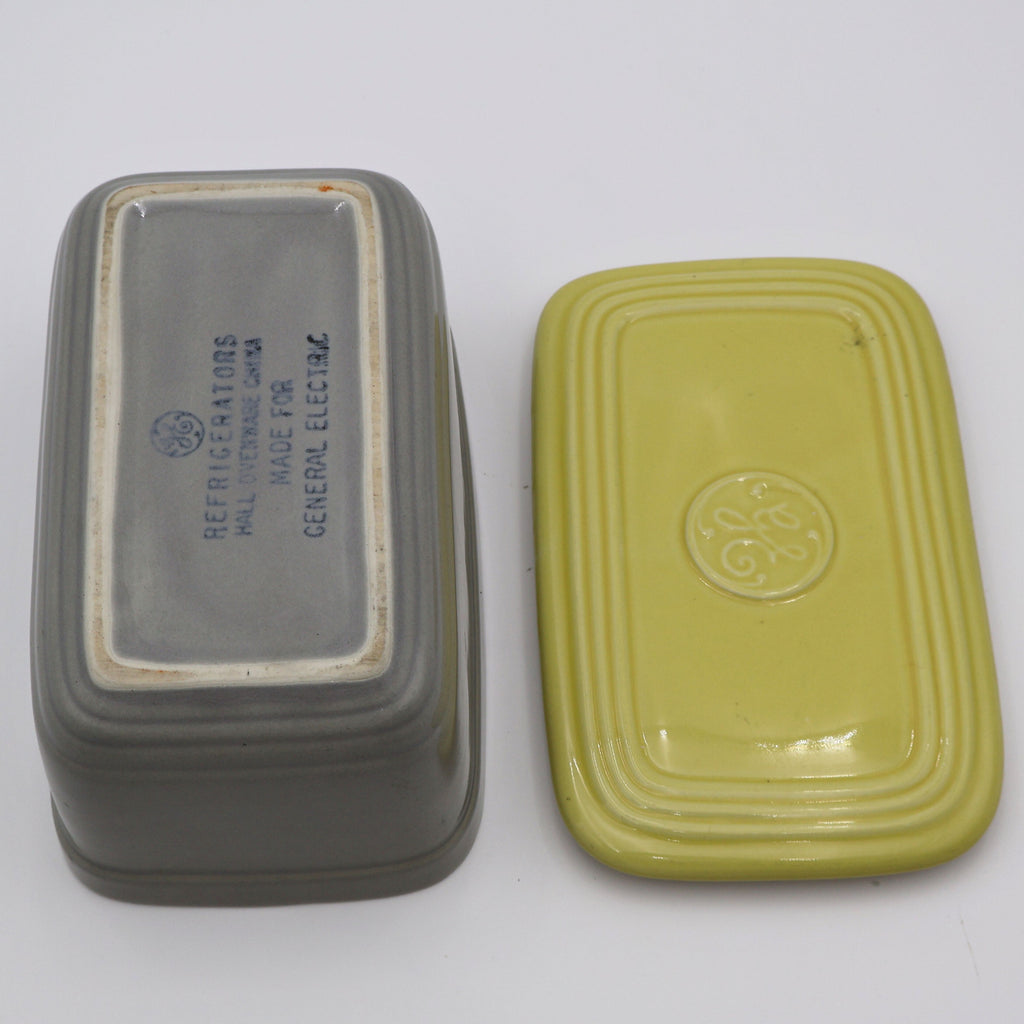 Open vintage GE refrigerator dish with lid showing makers mark and mid century design.